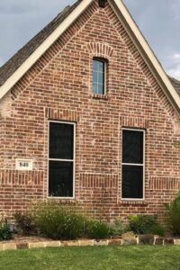 Red Brick Home Window Security Screens