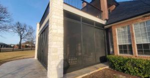 Side angle view of custom patio security screen enclosure in Frisco TX by Security Screen Masters of Texas