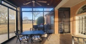 Evening lighting on custom patio security screen room in Dallas TX by Security Screen Masters of Texas