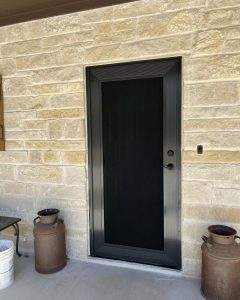 Custom security screen entry door mounted to Texas limestone masonry by Security Screen Masters of Texas