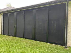 Custom back porch patio security enclosure installed in Texas by Security Screen Masters of Texas