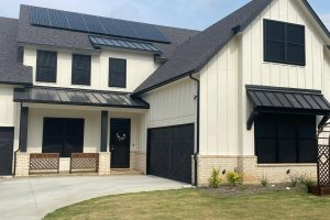 Modern white farmhouse with black security window screens in Austin TX by Security Screen Masters of Texas