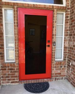 Custom red powder-coated security screen entry door installed in Dallas TX by Security Screen Masters of Texas