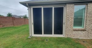 Three-panel sliding patio security screen doors installed by Security Screen Masters of Texas