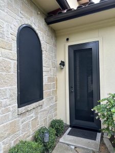 Arched security window screen and matching entry security door in San Antonio TX by Security Screen Masters of Texas