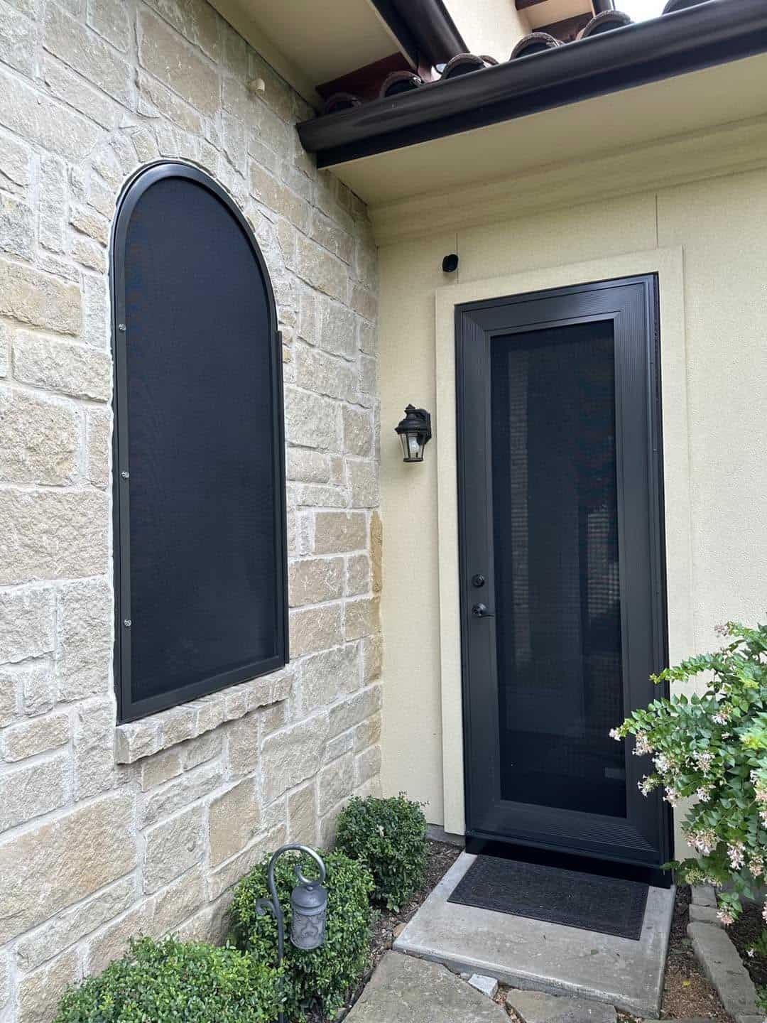 Arched security window screen and matching entry security door in San Antonio TX by Security Screen Masters of Texas