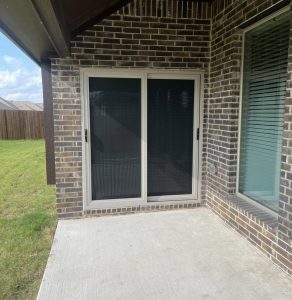Almond sliding glass patio security screen door installed in Waco TX by Security Screen Masters of Texas