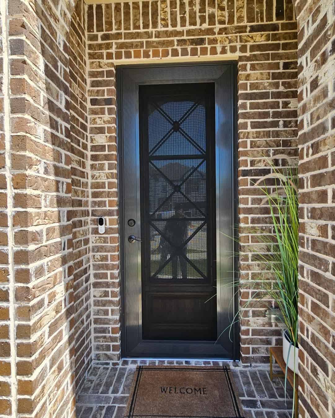 Diamond pattern security screen entry door installed on brick home in DFW by Security Screen Masters of Texas