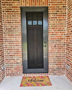 Craftsman bronze security screen door on red brick front porch in Arlington TX by Security Screen Masters of Texas