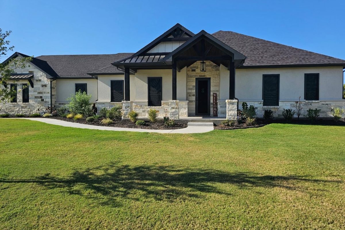 Full facade security window screens and entry door on Texas luxury ranch home by Security Screen Masters of Texas