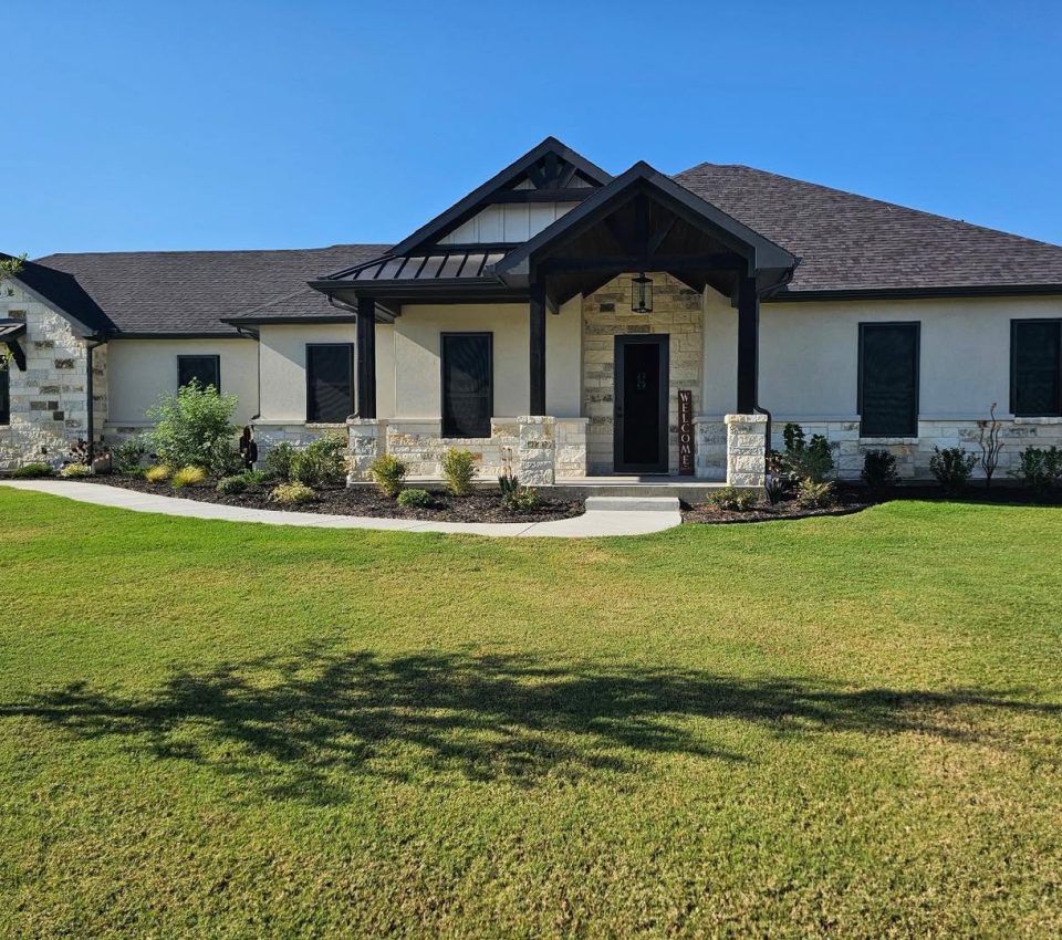 Full facade security window screens and entry door on Texas luxury ranch home by Security Screen Masters of Texas